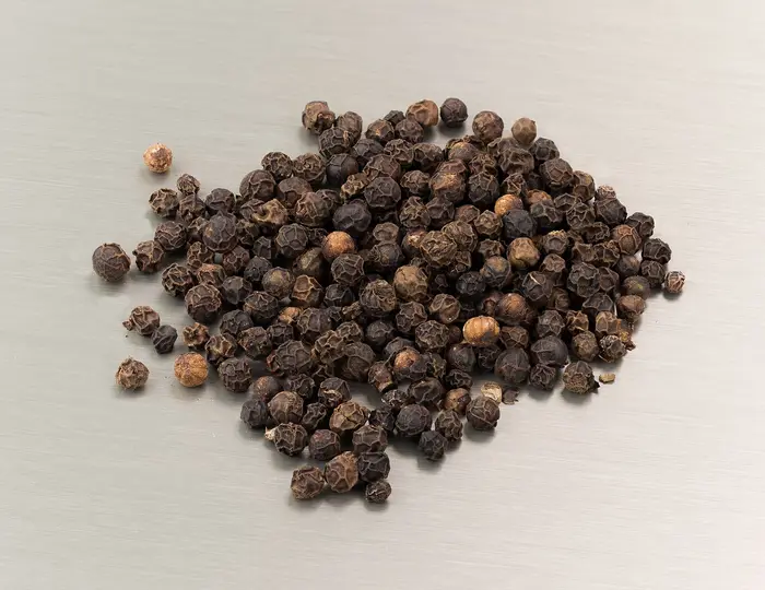 Whole black peppercorns